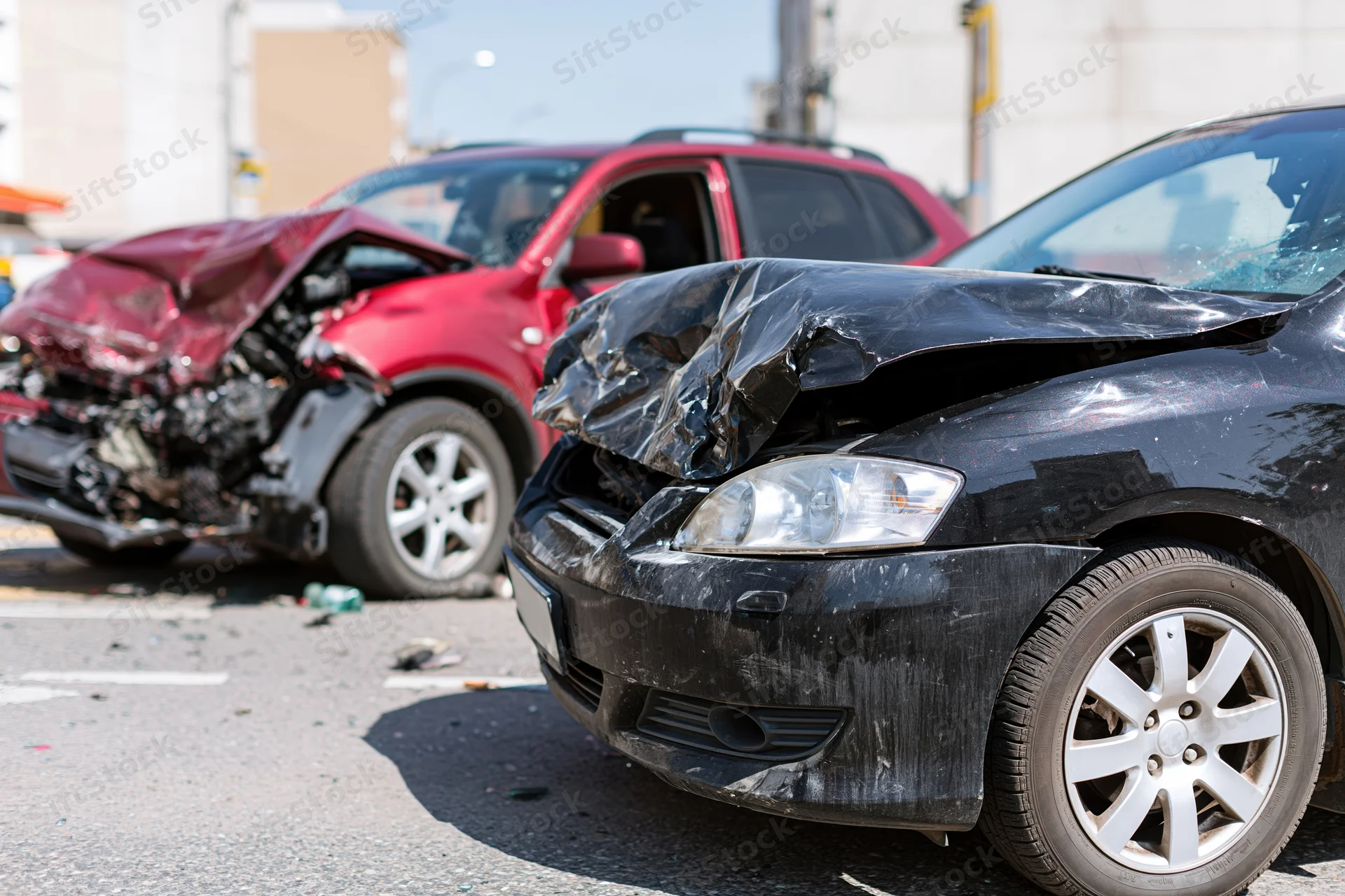 Two damaged cars after a collision on a road
