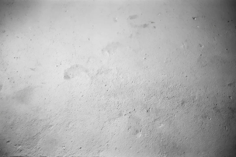 Weathered concrete wall surface filling the frame