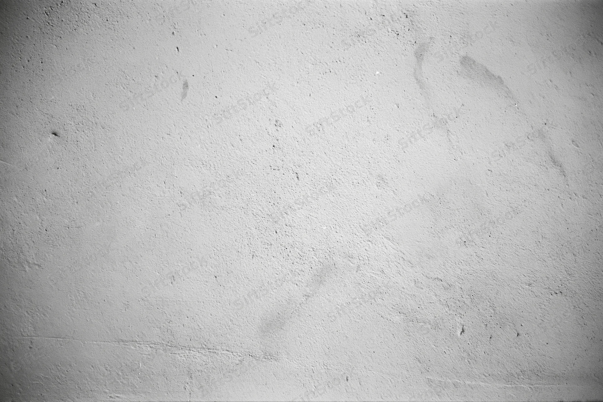 Weathered concrete wall surface filling the frame