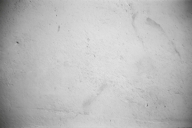 Weathered concrete wall surface filling the frame