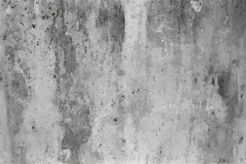 Weathered concrete wall surface filling the frame