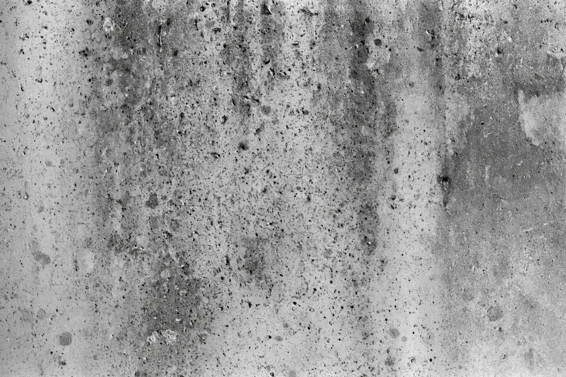 Weathered concrete wall surface filling the frame