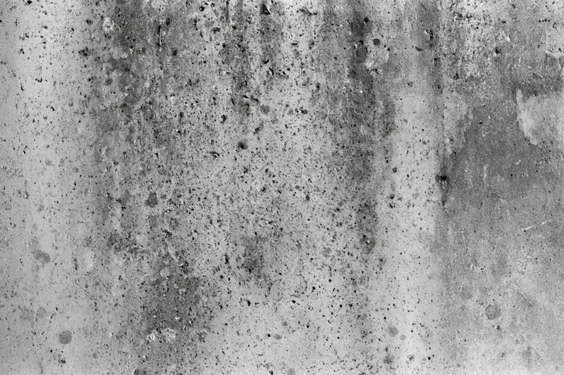 Weathered concrete wall surface filling the frame