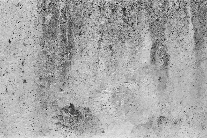 Weathered concrete wall surface filling the frame