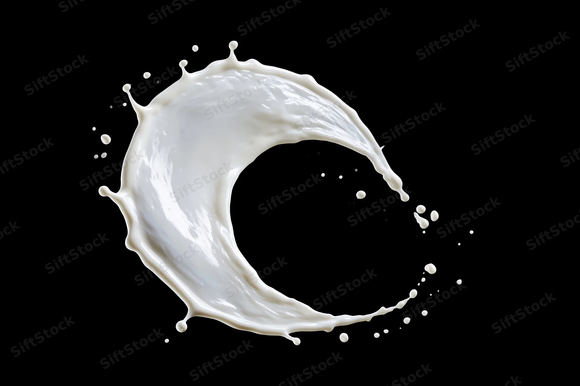 White milk splash frozen midair in sweeping arc shape against black background