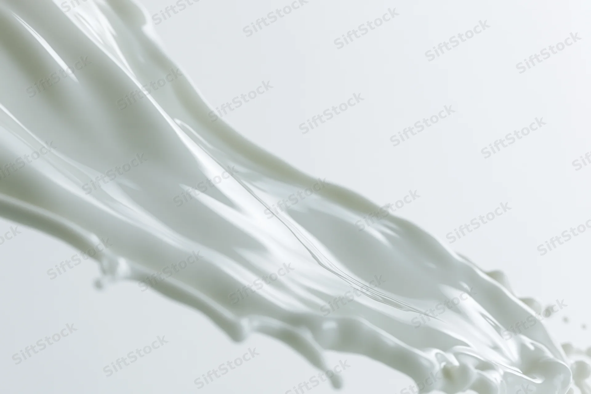 Flowing wave of white milk mid-splash against plain background