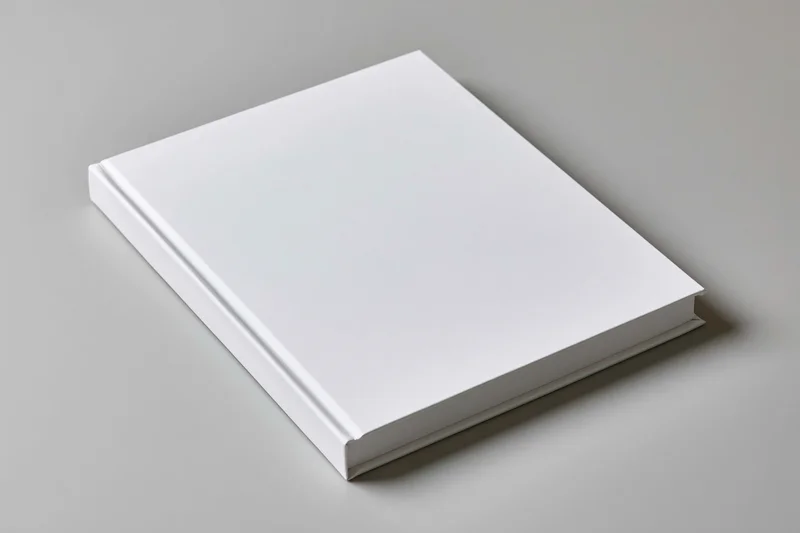 Blank white hardcover book lying flat on a neutral surface with copyspace for design or branding