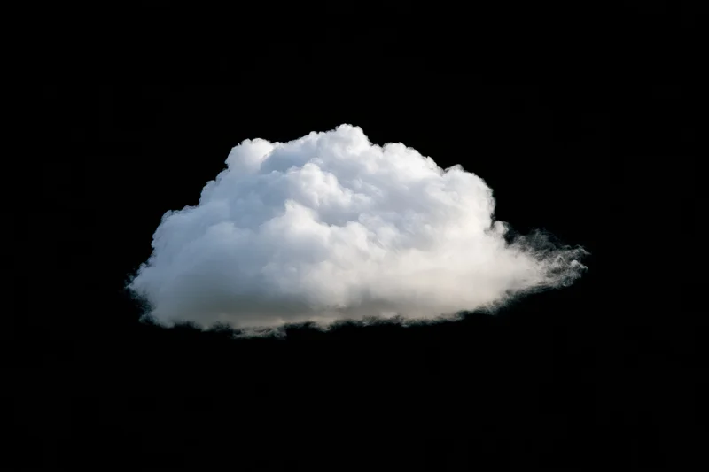Fluffy white cumulus cloud isolated against black background
