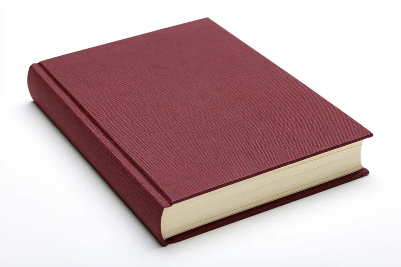 Hardcover book with dark red cloth cover on white background