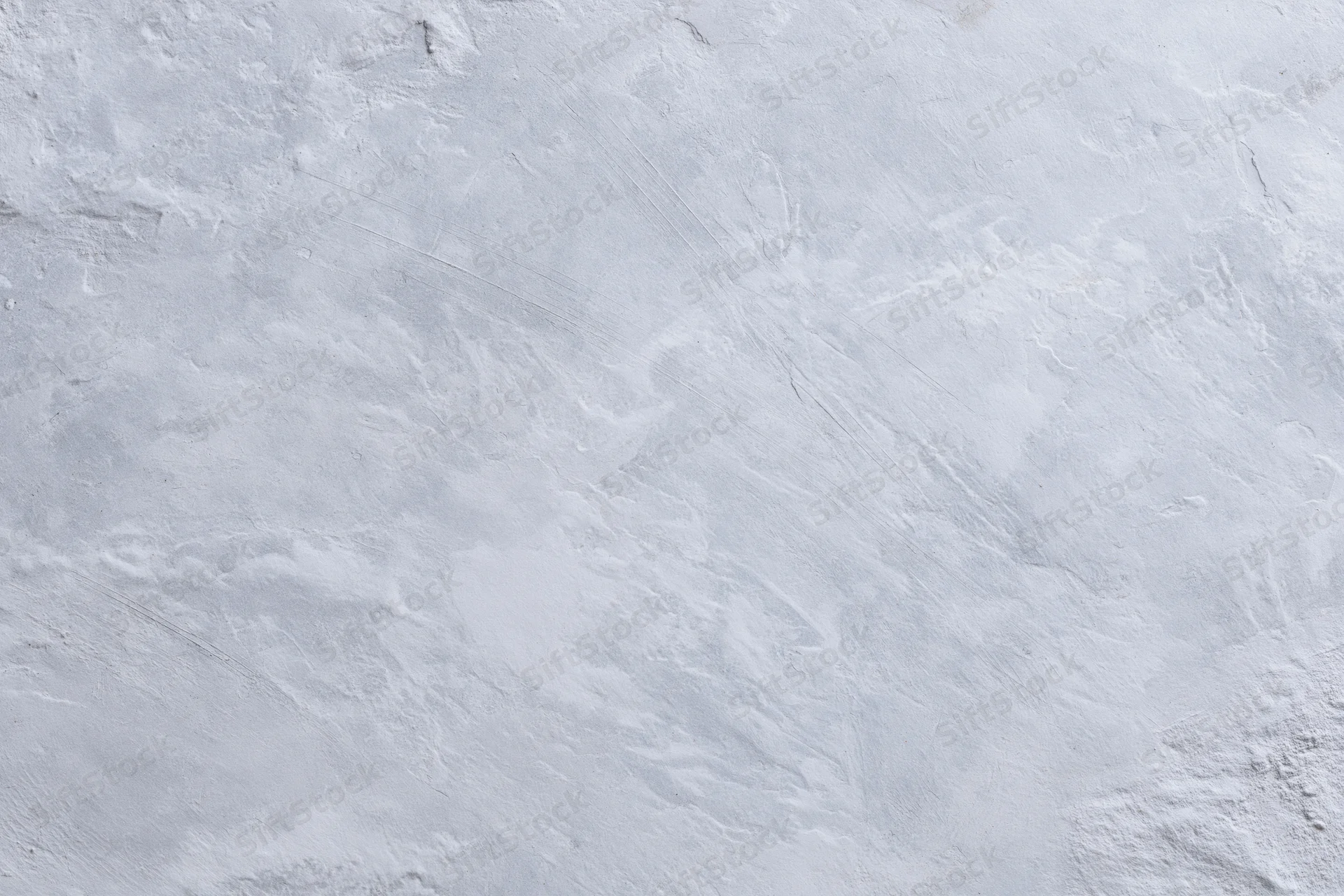 Close-up of a textured gray concrete wall surface filling the frame