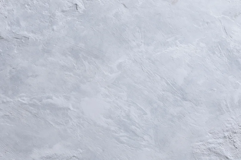 Close-up of a textured gray concrete wall surface filling the frame