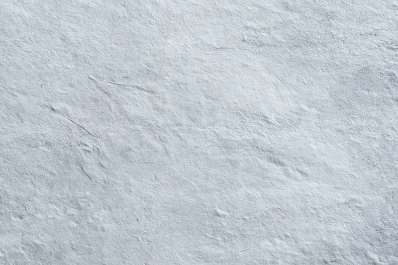 Close-up of a rough gray concrete wall surface filling the frame