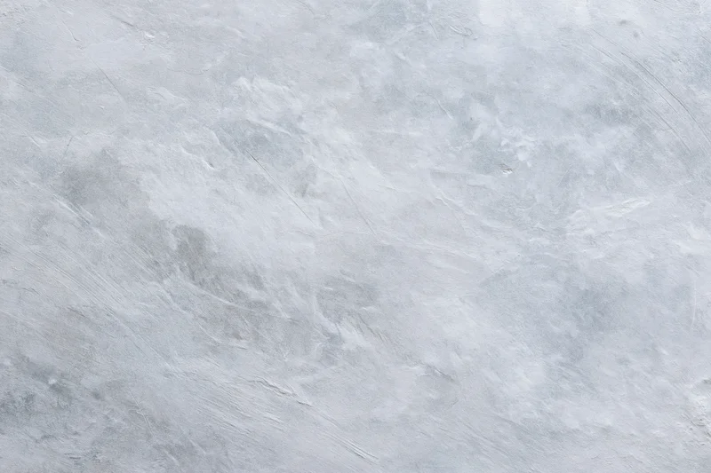 Close-up of a bare concrete wall surface with rough texture filling the frame
