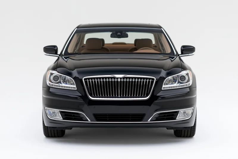 Black luxury sedan front view isolated on white background