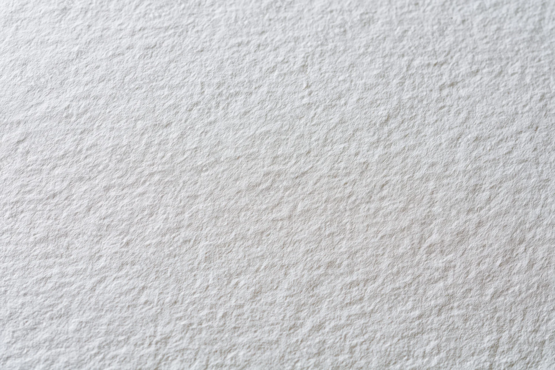 Close-up of textured white paper surface for art or design projects