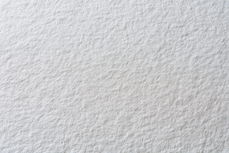 Close-up of textured white paper surface for art or design projects