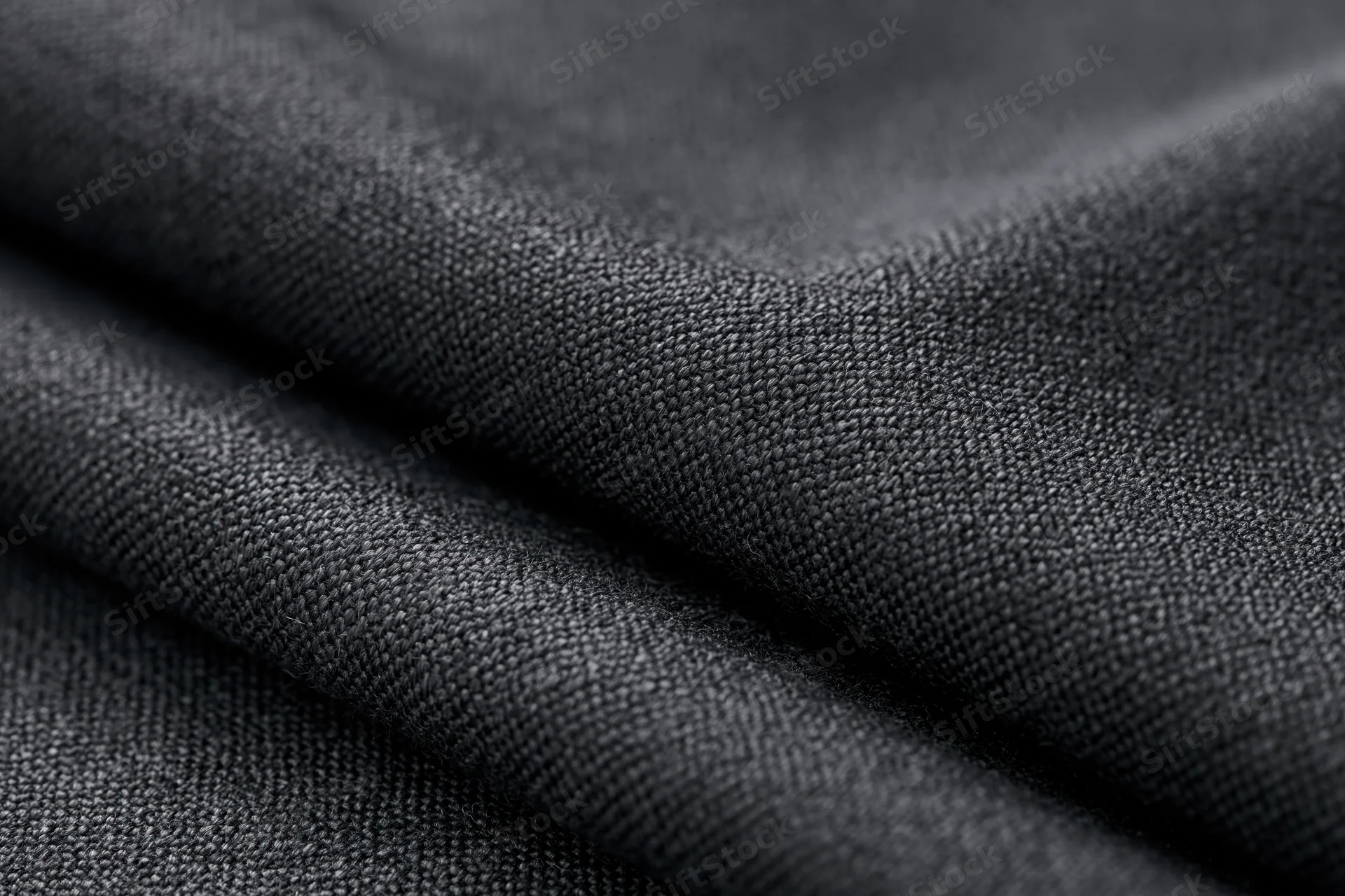 Close-up of dark charcoal woven fabric texture filling the frame