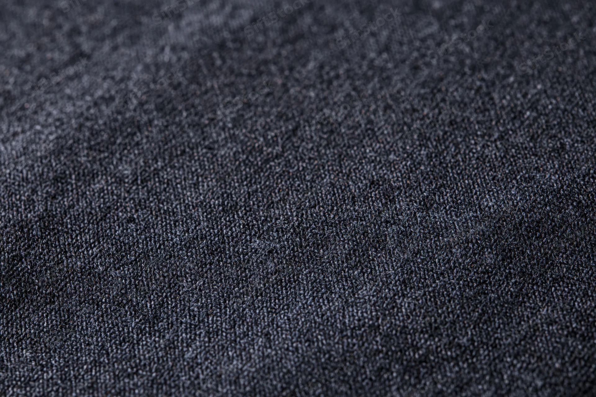 Close-up of dark charcoal fabric texture filling the frame