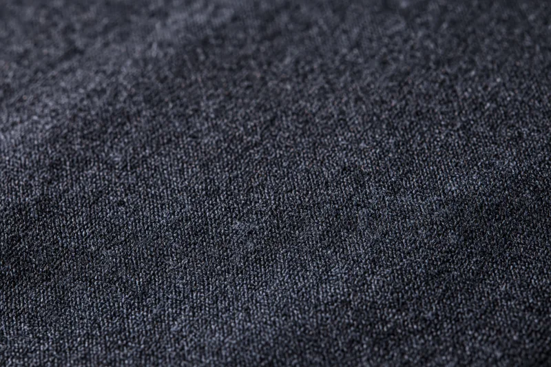 Close-up of dark charcoal fabric texture filling the frame