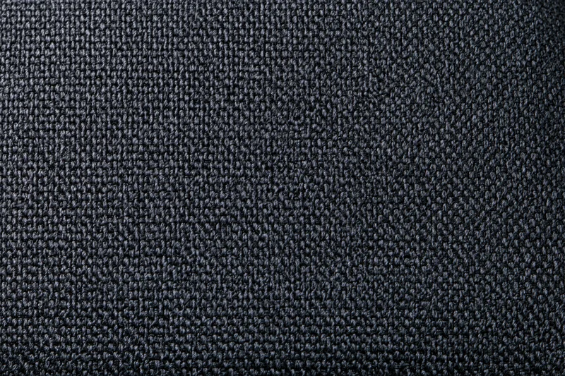 Close-up of dark charcoal woven fabric texture filling the frame