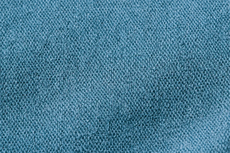 Close-up of blue woven cotton fabric texture filling the frame