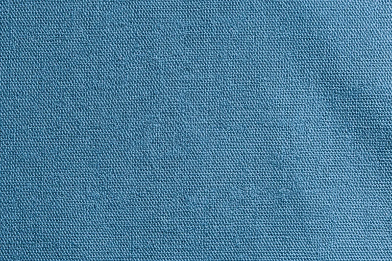 Close-up of blue woven cotton fabric texture filling the frame