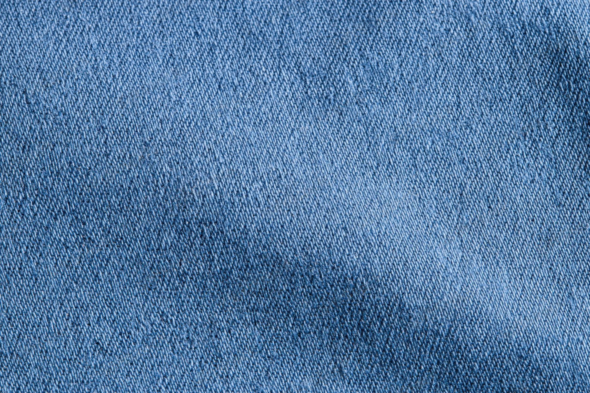 Close-up of blue denim fabric texture filling the frame