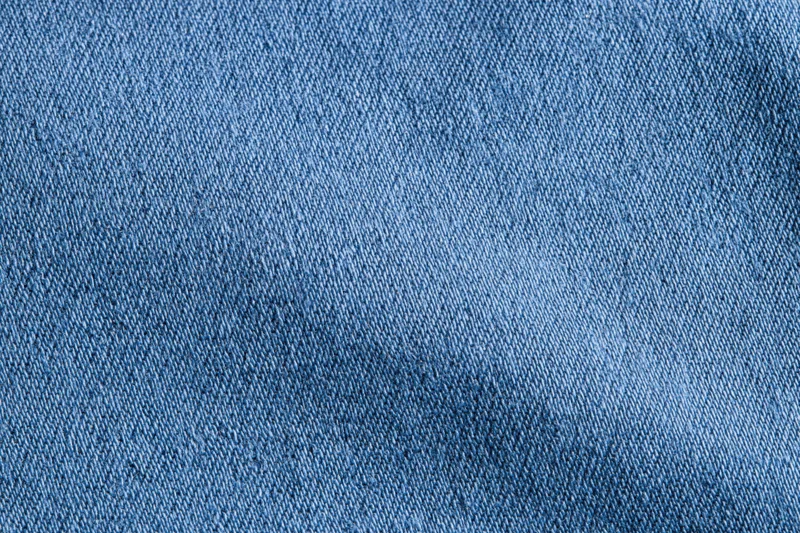 Close-up of blue denim fabric texture filling the frame
