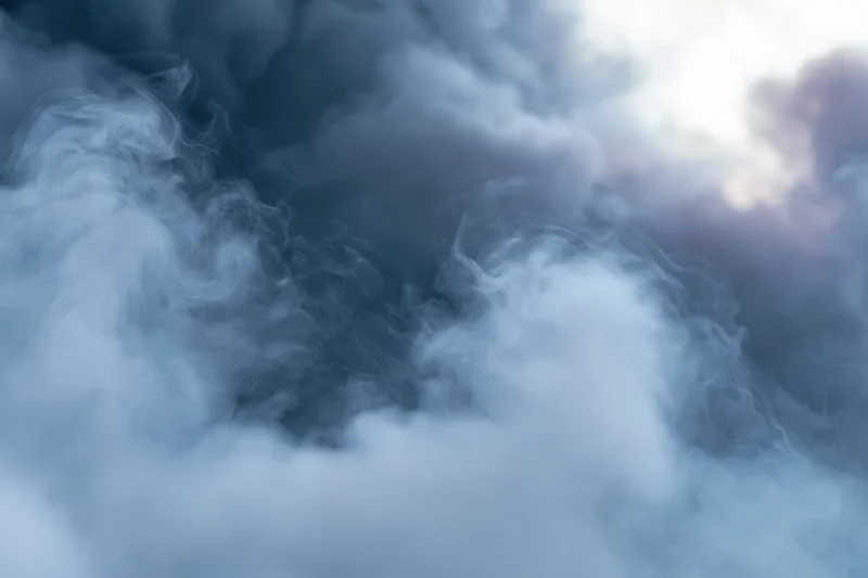 Swirling smoke filling the frame in an abstract closeup view