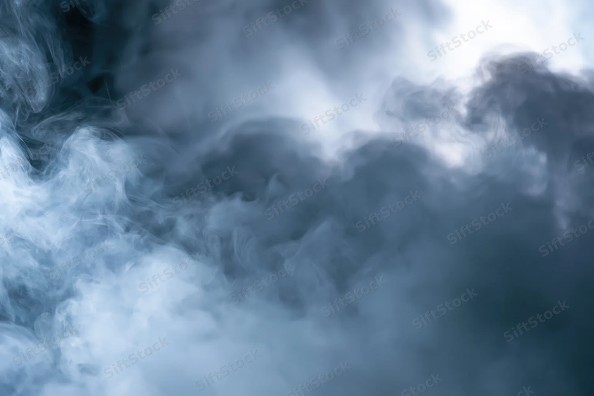Dense swirling smoke filling the frame in abstract closeup