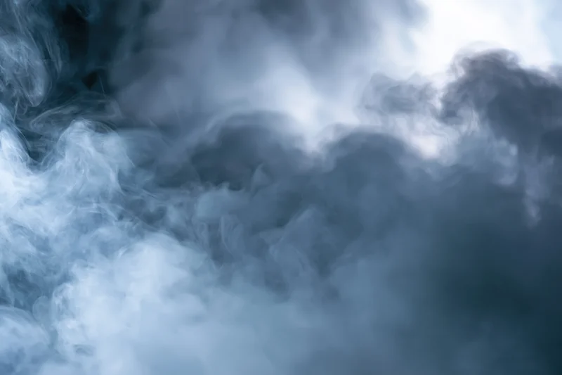 Dense swirling smoke filling the frame in abstract closeup