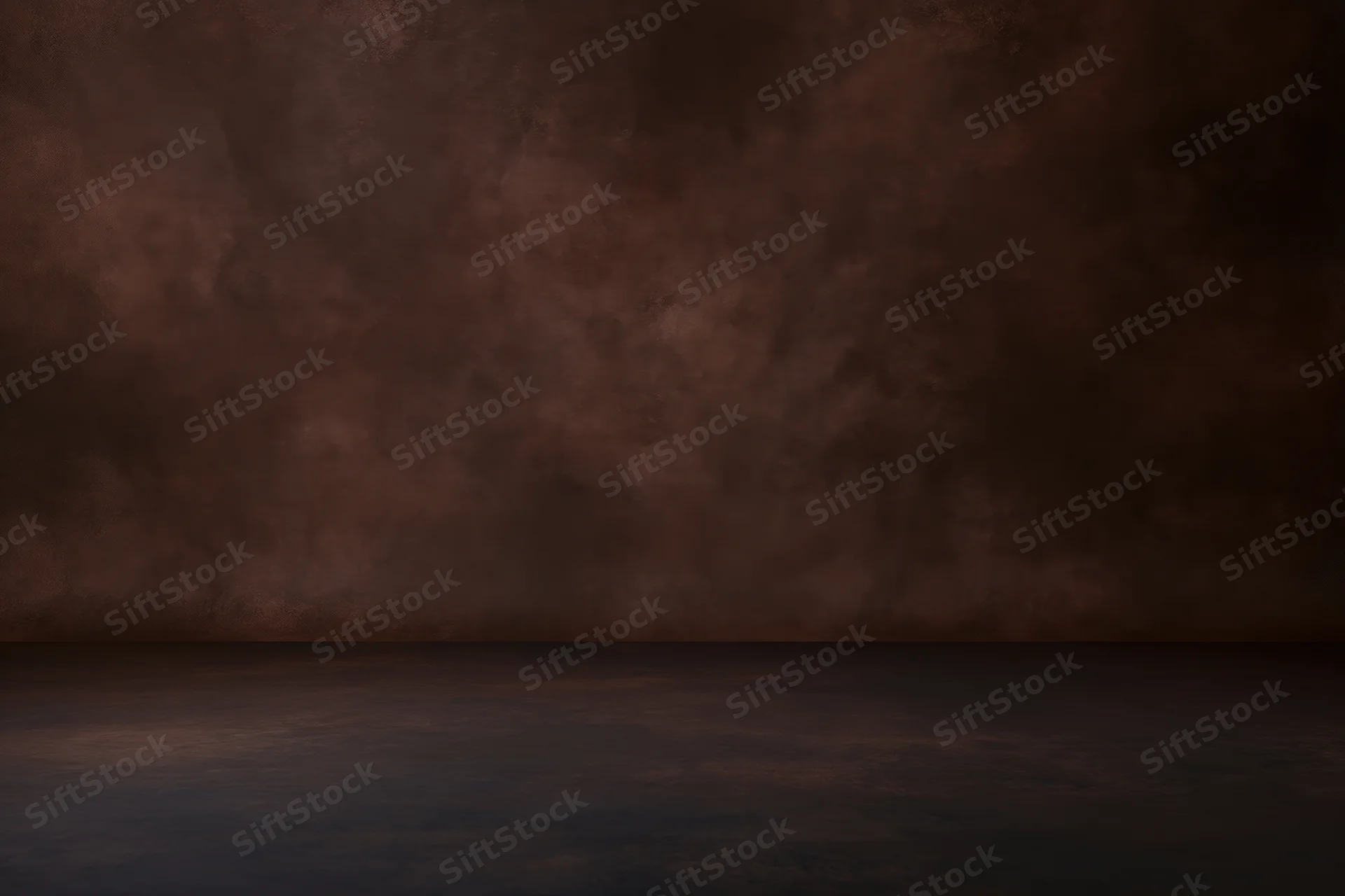 Empty studio space with mottled dark brown painted backdrop and floor