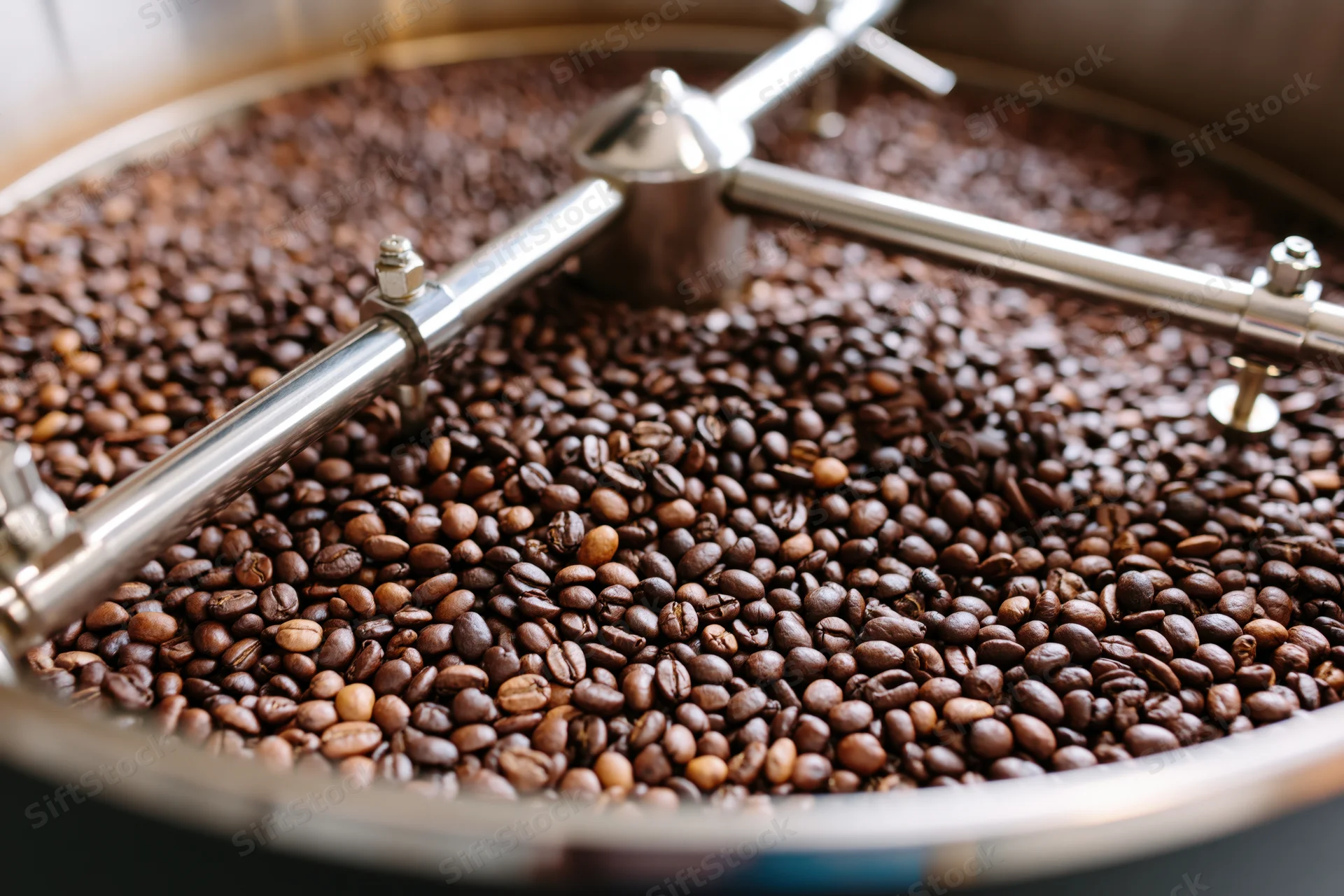 Coffee beans cooling in a large industrial roasting drum