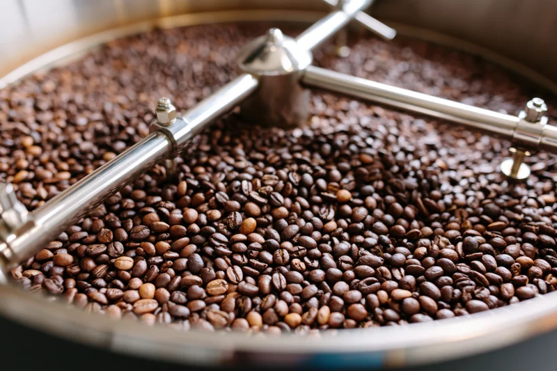 Coffee beans cooling in a large industrial roasting drum
