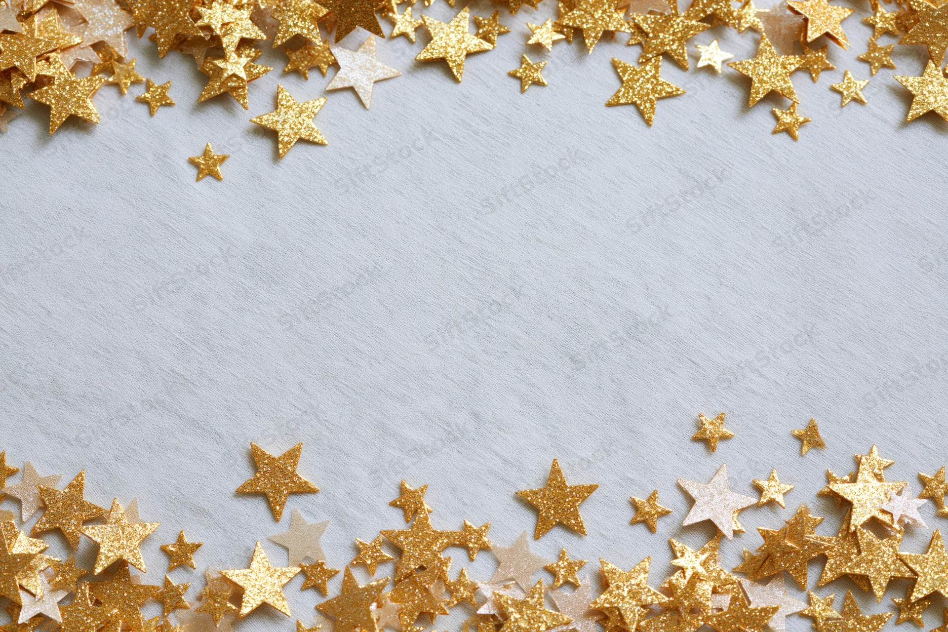 Gold metallic star-shaped confetti scattered along top and bottom edges of white textured surface, leaving central copyspace