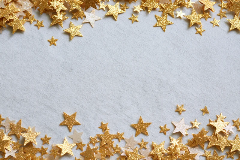 Gold metallic star-shaped confetti scattered along top and bottom edges of white textured surface, leaving central copyspace