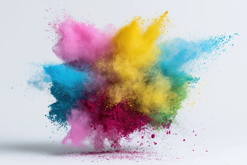 Colorful powder exploding mid-air against white background