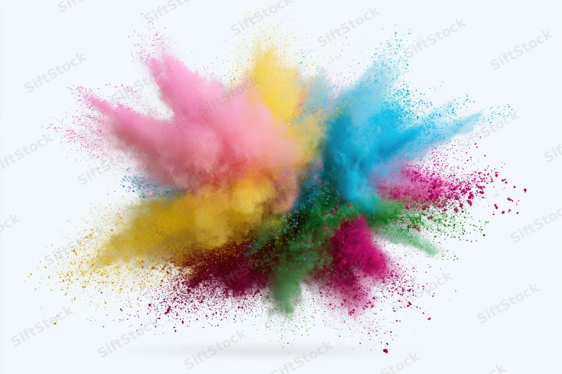 Colorful powder exploding midair against white background