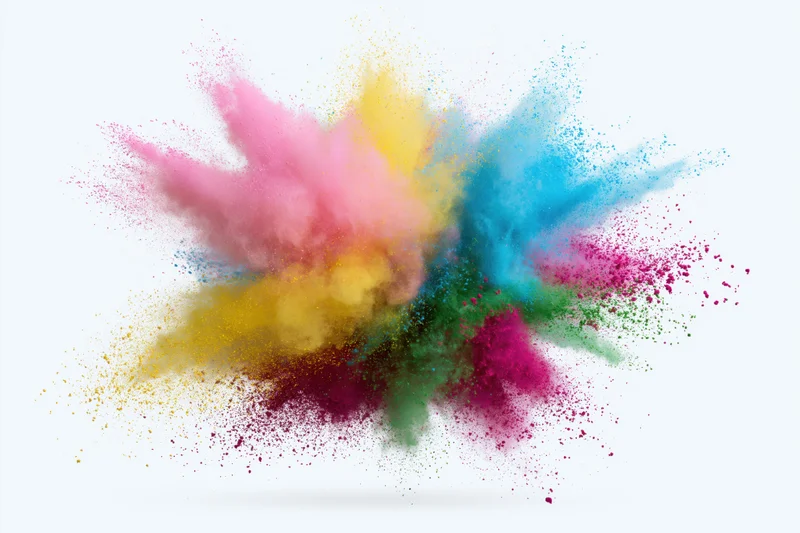Colorful powder exploding midair against white background