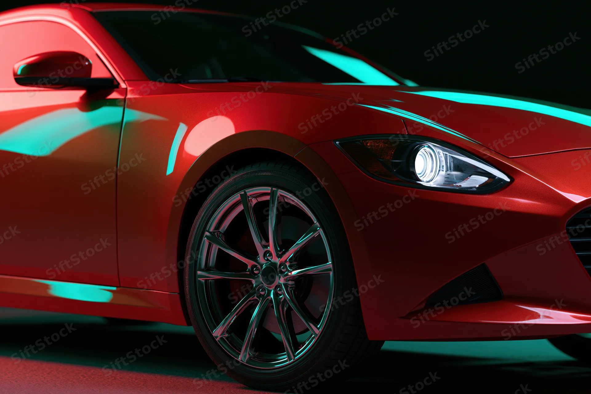 Red sports coupe in three-quarter front view in dark studio with teal lighting reflections on glossy body and alloy wheel