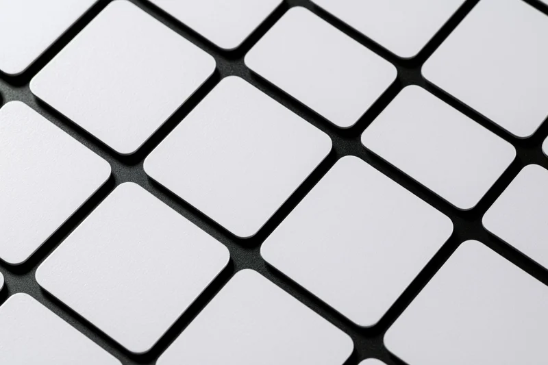 White rounded rectangle cards arranged in diagonal grid pattern on black surface
