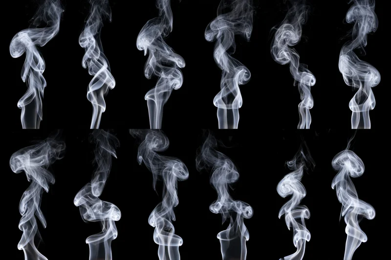 White smoke plumes rising in two rows against black background