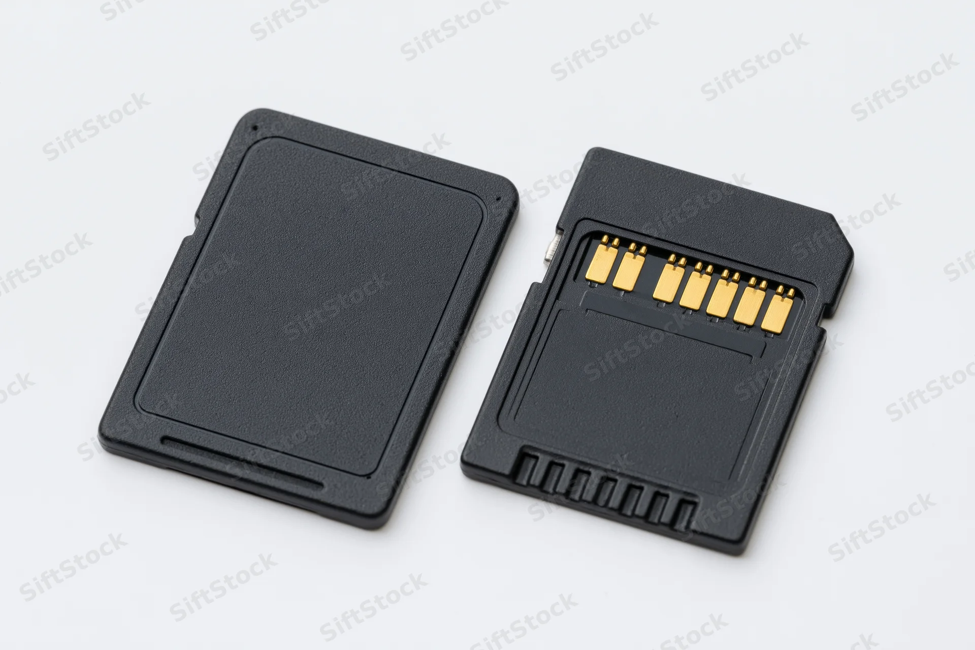 Two black sd memory cards side by side on white background showing front and connector details