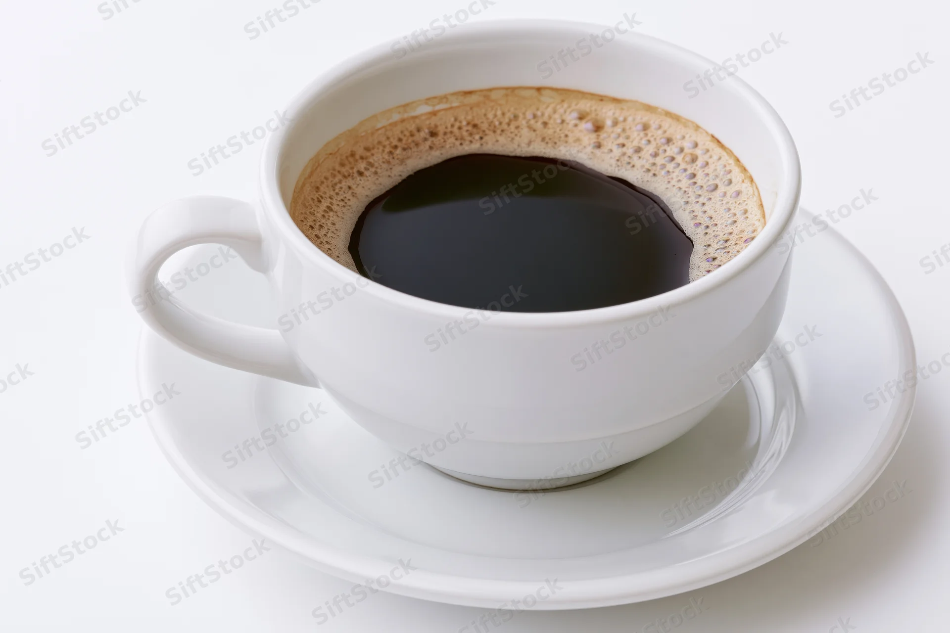 White ceramic coffee cup filled with black coffee on a saucer against a plain white background
