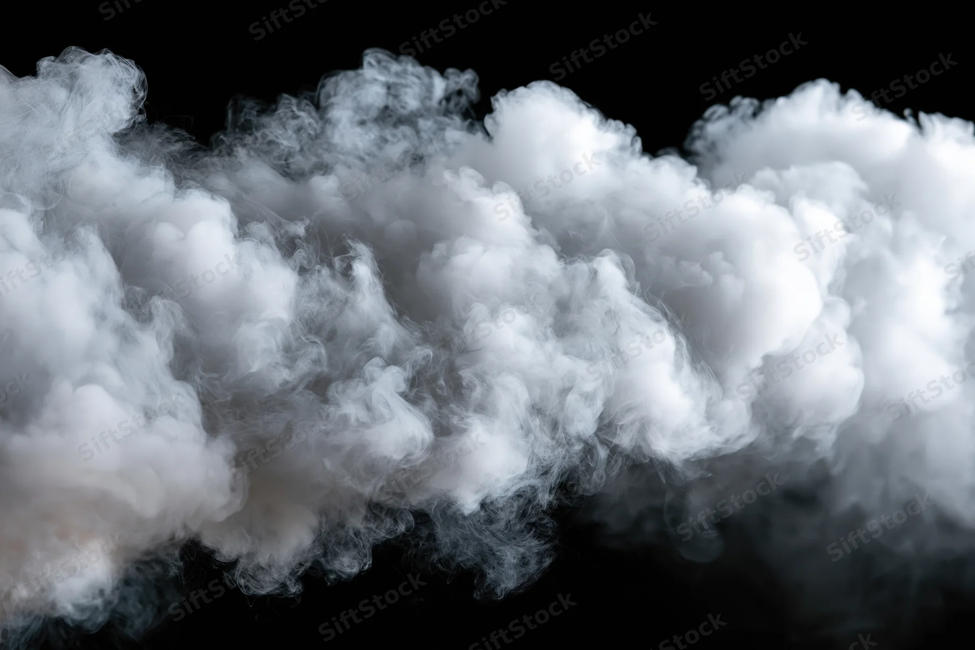 Dense white smoke billowing horizontally across black background