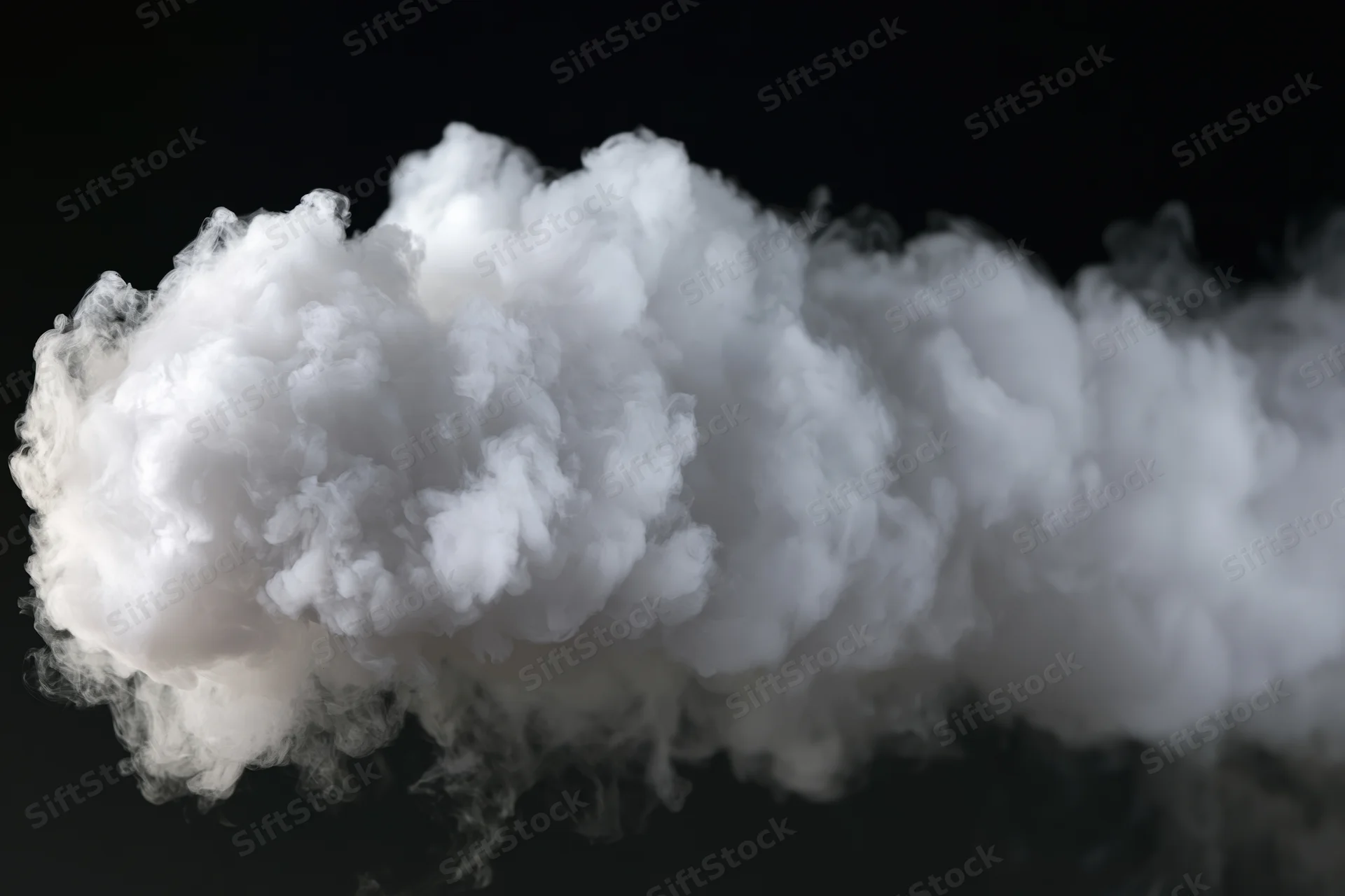 Dense white smoke billowing horizontally against black background