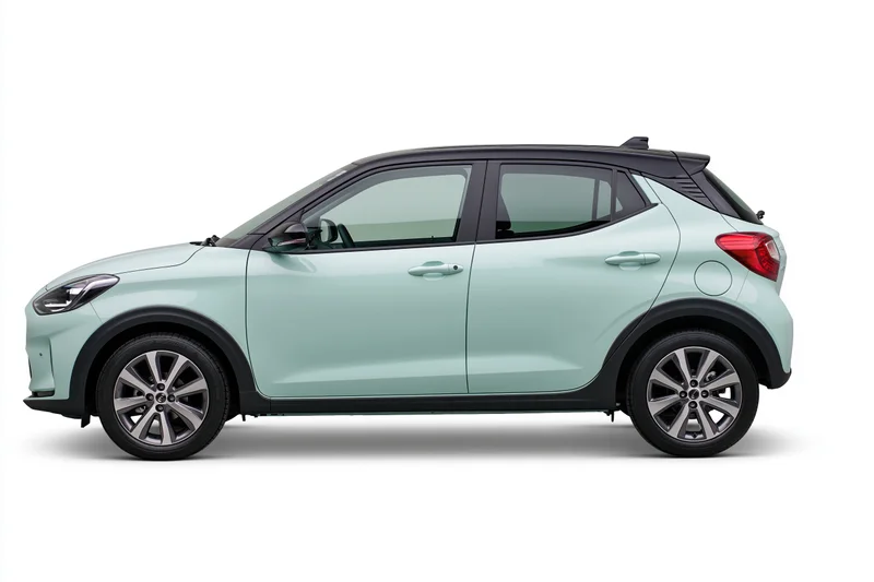 Pale mint green compact hatchback shown in side profile against white background