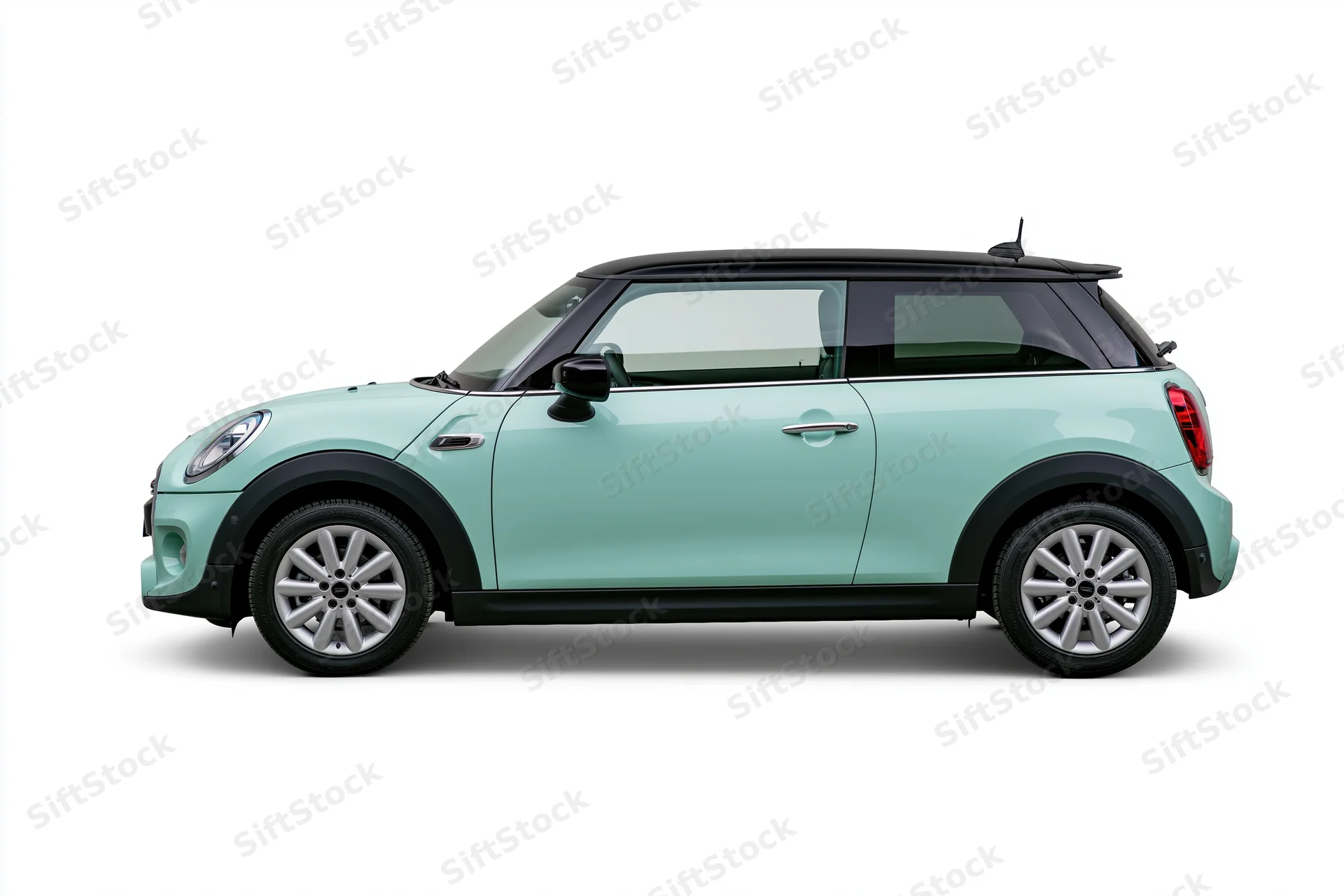 Pale mint green compact hatchback car shown in side profile against white background