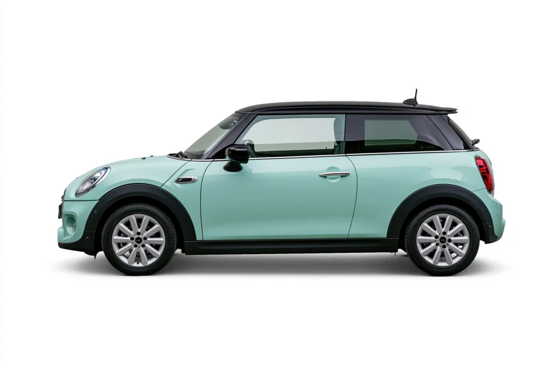 Pale mint green compact hatchback car shown in side profile against white background