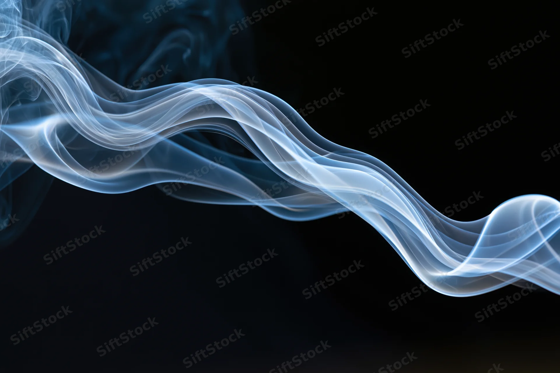 A wisp of white and blue smoke curling and twisting horizontally across a dark background
